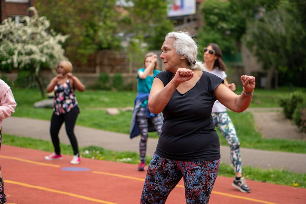 women on an outdoor track exercising